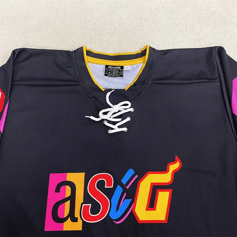 Close-up of a lace-up hockey neckline and multicolor chest artwork